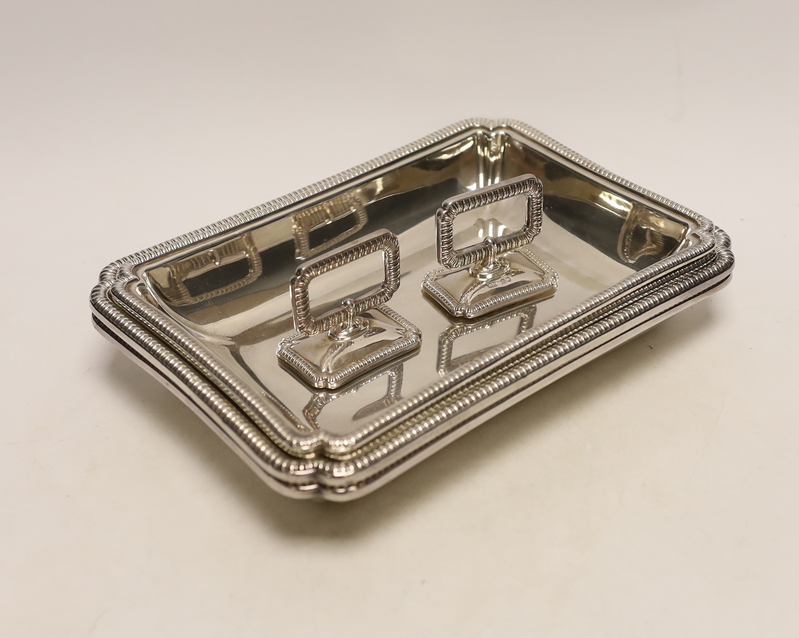 A pair of George V silver rectangular entrée dishes with covers and handles, by George Howson